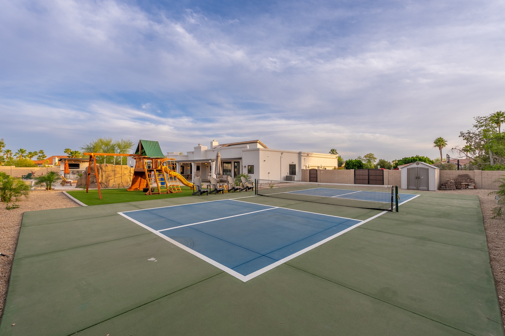 Enjoy sunny days on your private tennis court or let the kids play on the playground—all while relaxing by the pool under expansive desert skies.