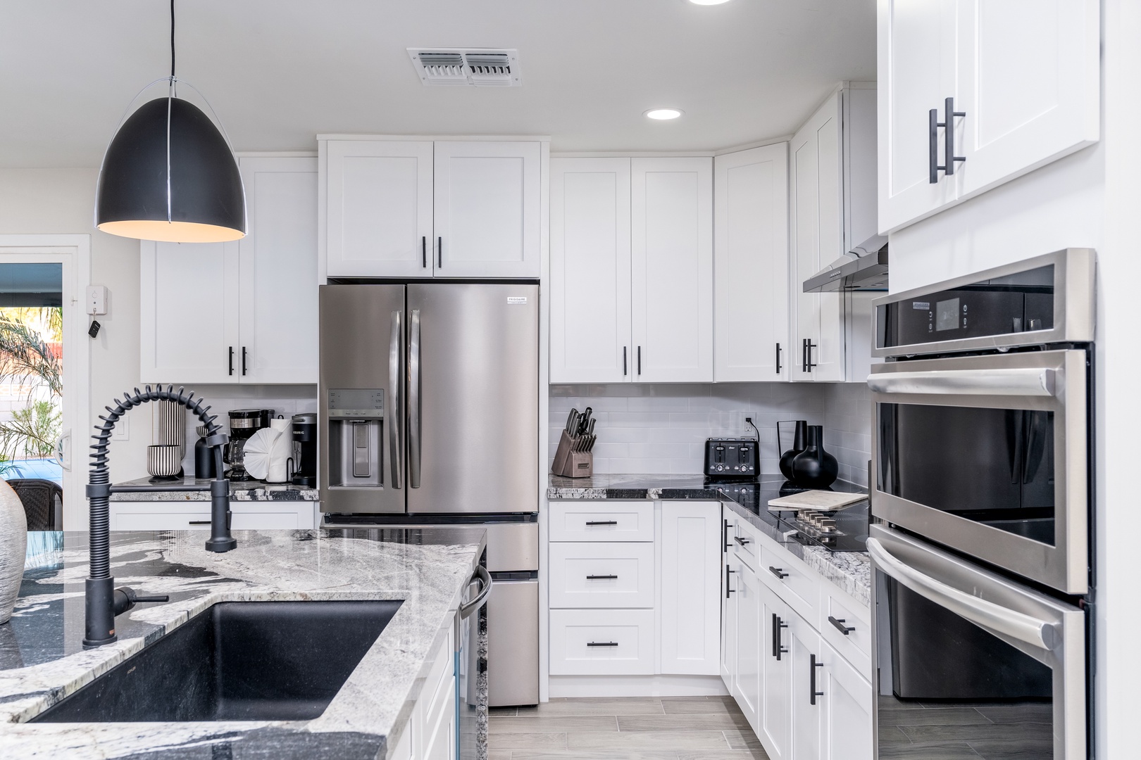 Your gourmet kitchen awaits with sleek stainless appliances, granite counters, and abundant storage—perfect for preparing everything from quick breakfasts to memorable family feasts.