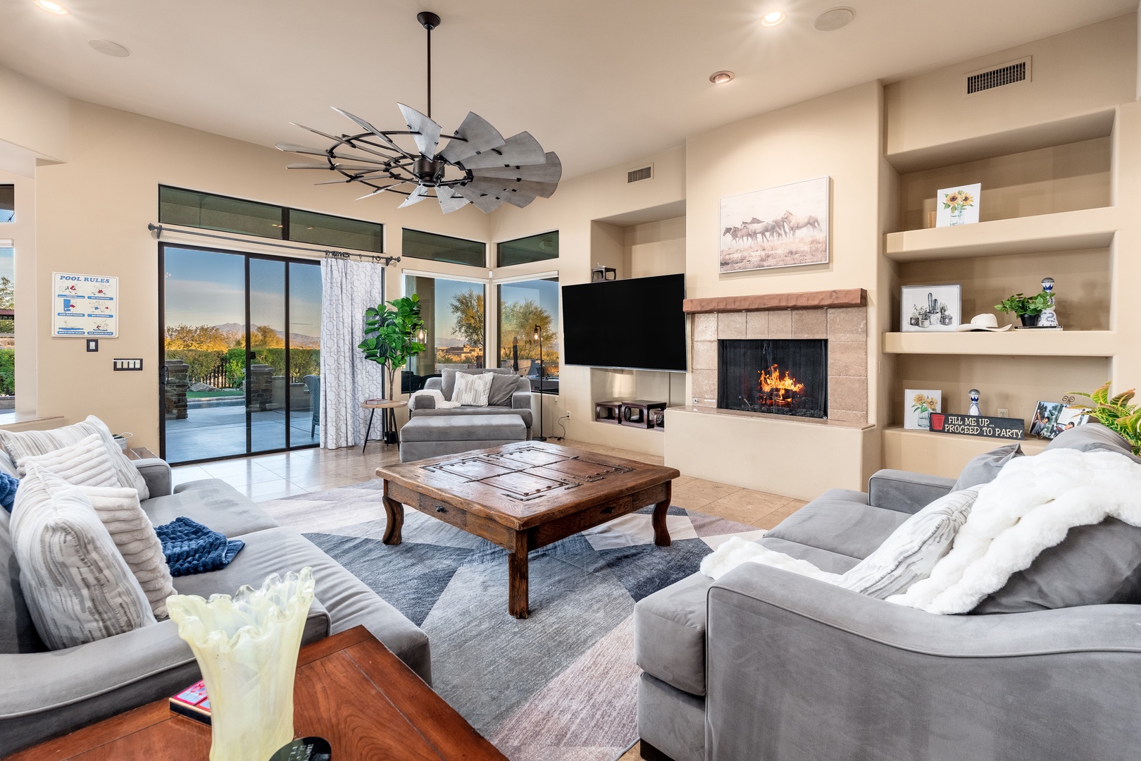 Sink into plush sofas by the fireplace or step through sliding doors to your private patio—your perfect retreat awaits.
