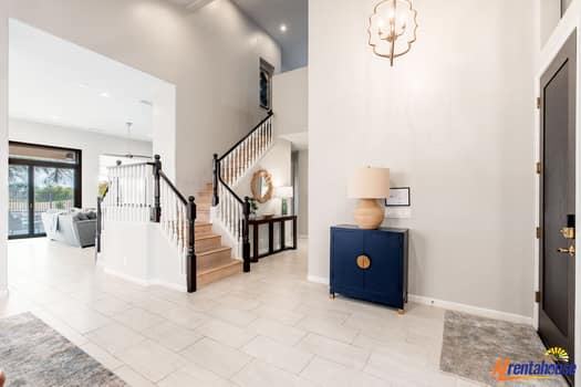 Your grand foyer welcomes you with soaring ceilings and elegant marble floors, setting the tone for sophisticated comfort throughout your stay.