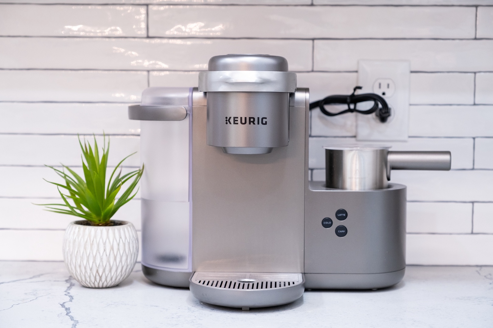 Your morning ritual made easy—brew fresh coffee and froth milk with this sleek Keurig setup, ready whenever you need that perfect cup.