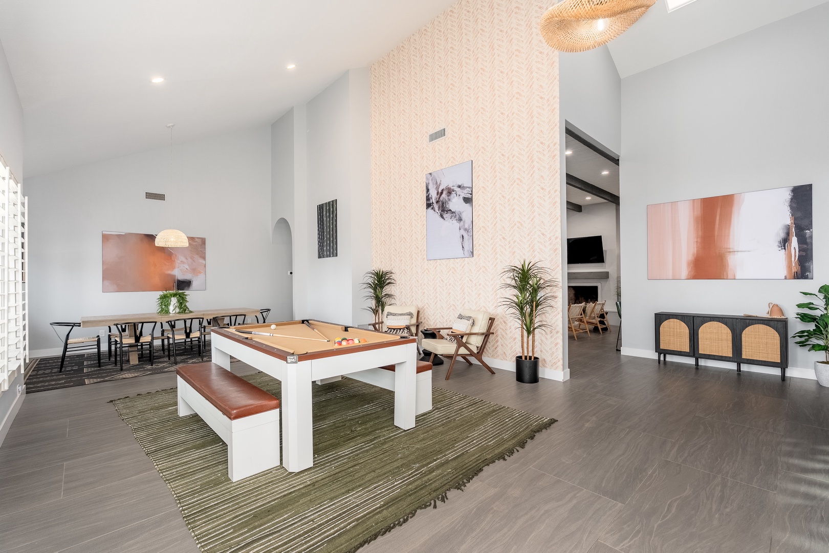Your stylish retreat features soaring ceilings, a custom pool table for friendly competitions, and elegant artwork that sets a sophisticated yet welcoming tone throughout.