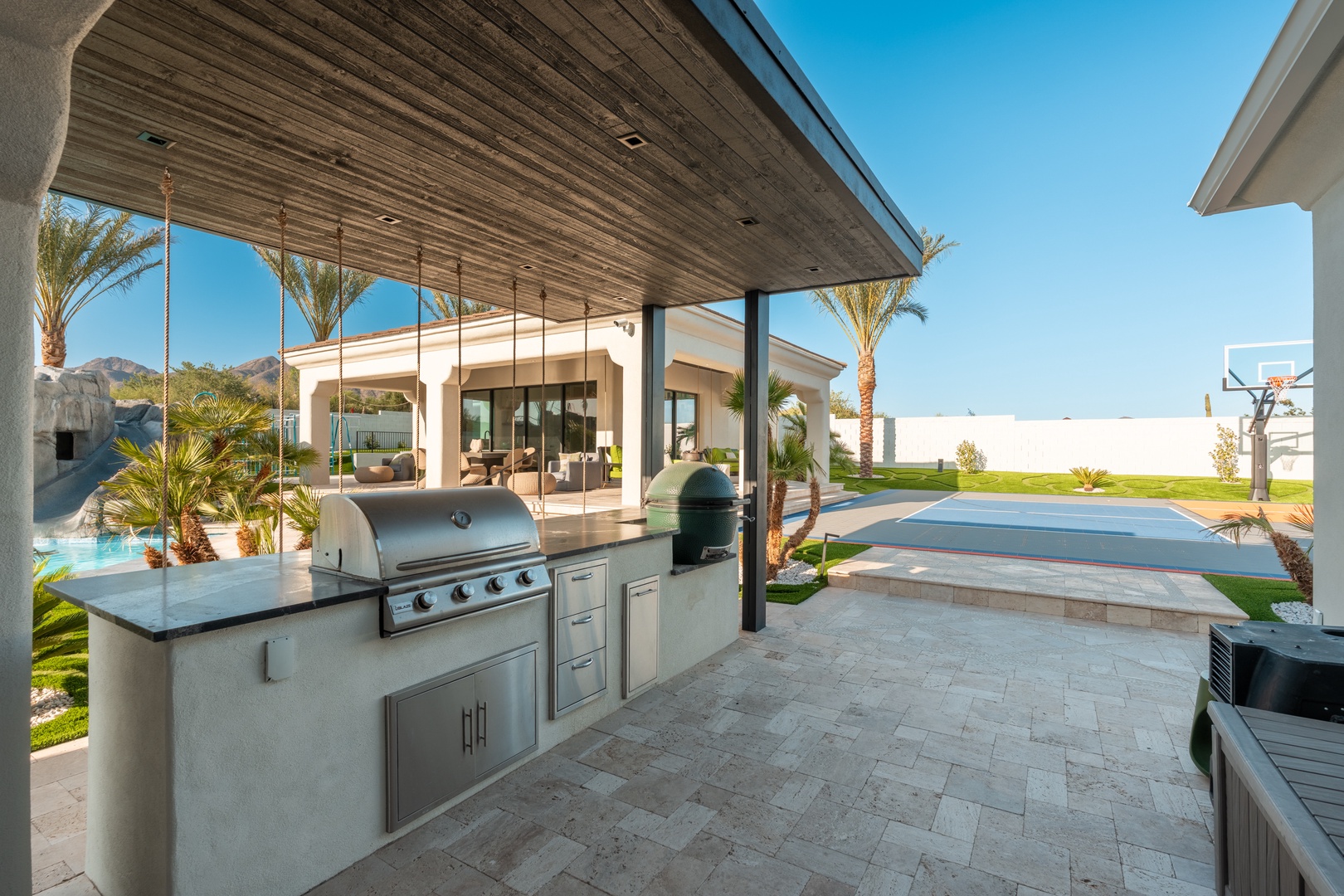 Grill your favorite meals in this elegant outdoor kitchen, complete with premium appliances and mountain views to enhance every gathering.