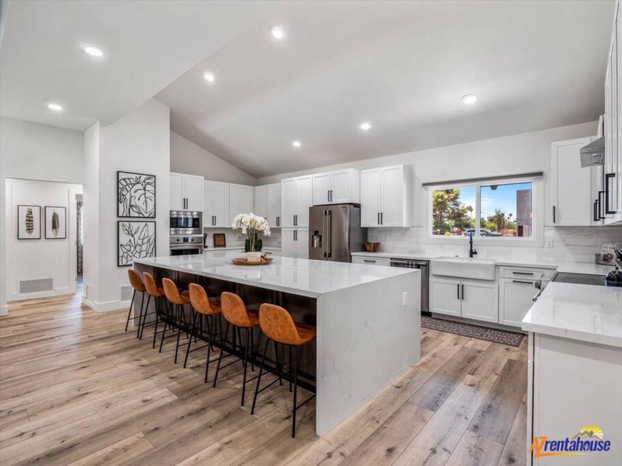 Your gourmet kitchen features gleaming white countertops, premium appliances, and a stunning island where you'll gather for memorable meals together.