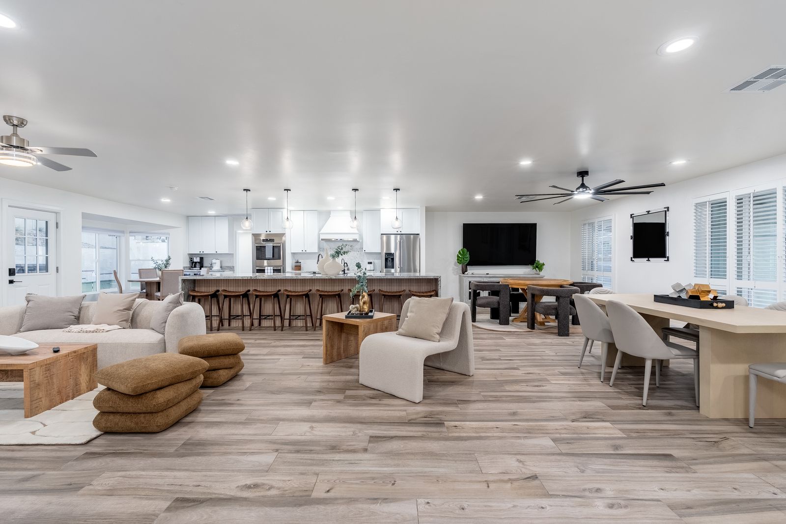 Sink into plush seating in your open-concept haven, where natural light floods the space, warm wood tones invite conversation, and a chef's kitchen awaits your culinary adventures.