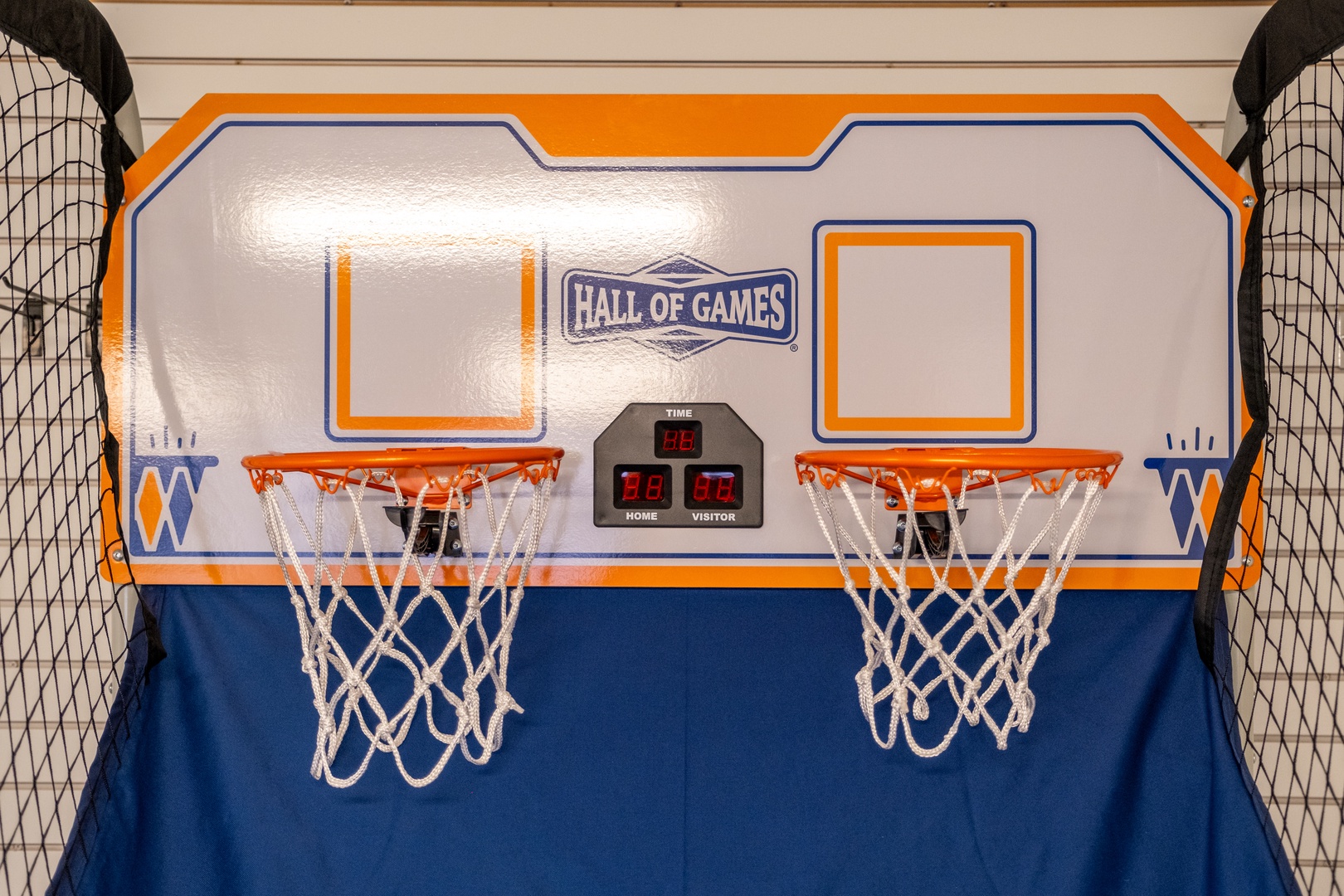 Challenge family or friends to a friendly game on this dual-hoop basketball setup complete with electronic scoreboard to track your victories.