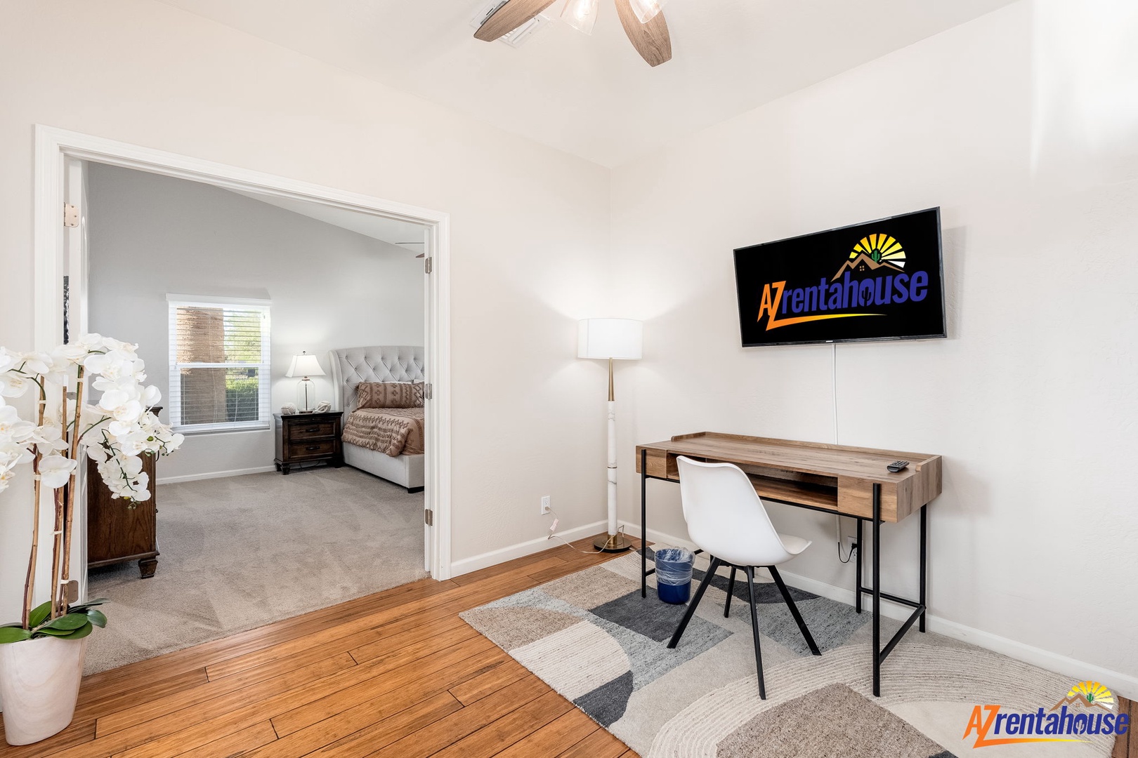 Your modern workspace is right here, with a sleek desk, natural light, and a cozy bedroom view just steps away.