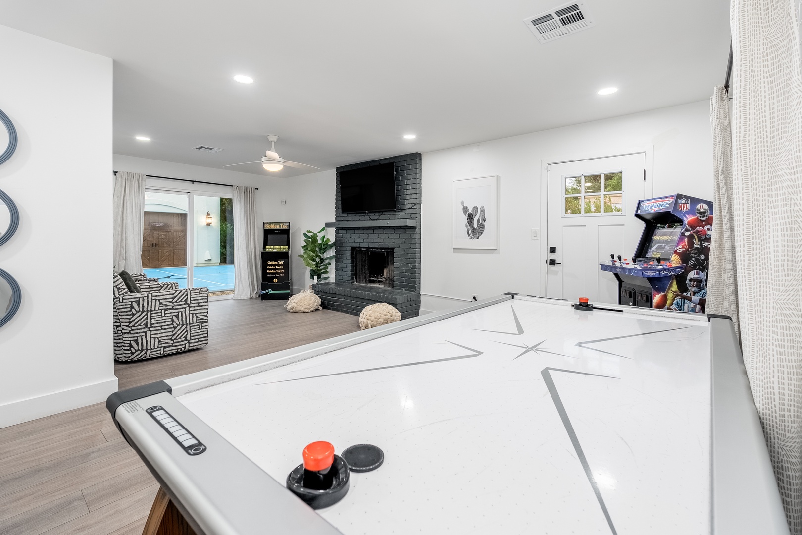 Your private game room awaits with air hockey, arcade fun, and a cozy fireplace—perfect for friendly competition and unwinding after a day of adventure.