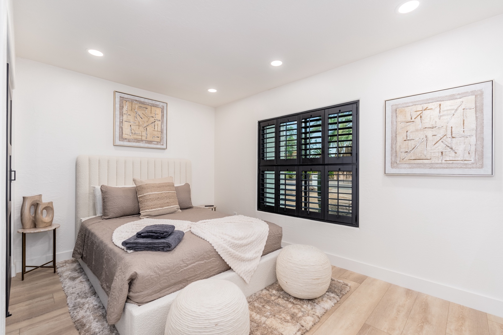 Unwind in your peaceful bedroom with its plush linens, chic décor, and soft ambient lighting—your perfect retreat for restful nights.