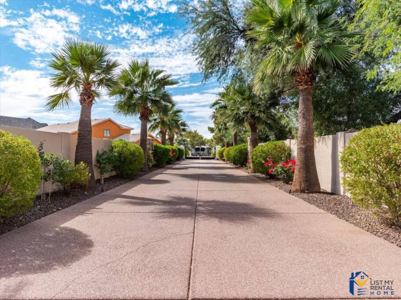 Arrival at this desert oasis features a palm-lined walkway surrounded by meticulously landscaped grounds and mountain vistas.