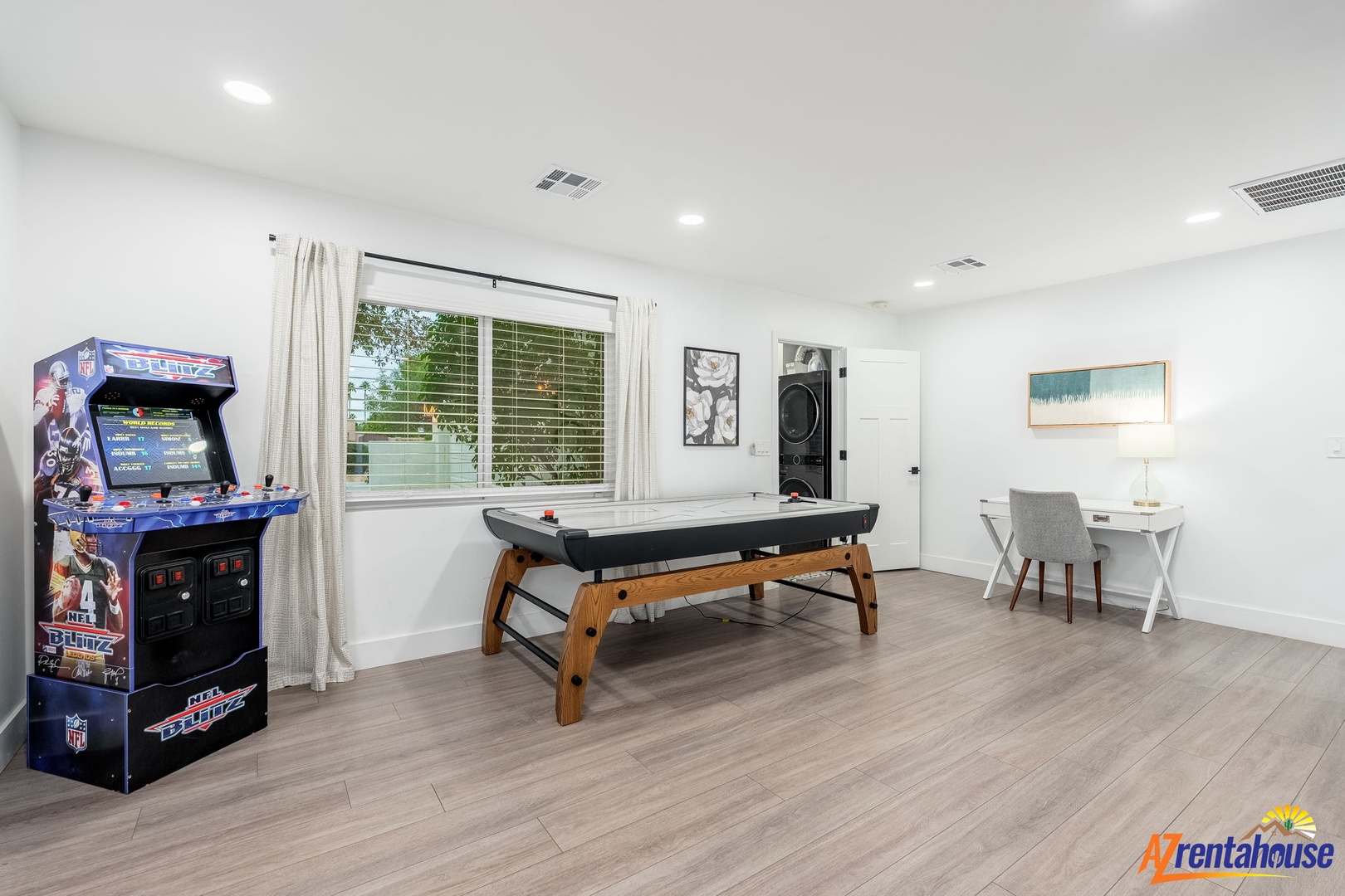 Your private game room awaits with arcade fun, air hockey battles, and a cozy workspace for downtime between adventures.