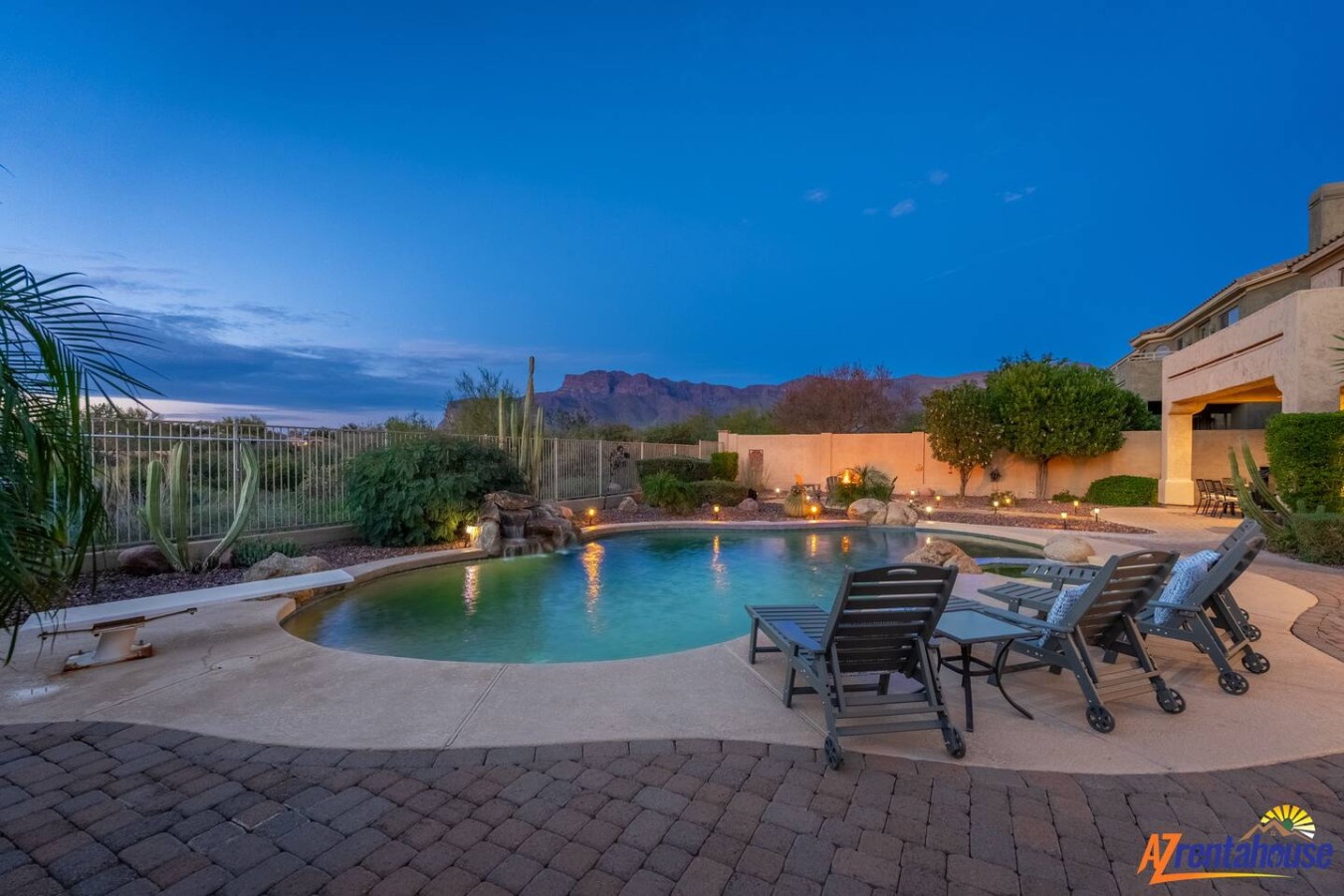 Stunning desert oasis with private pool, mountain views, and ambient lighting for magical evenings under Arizona skies.