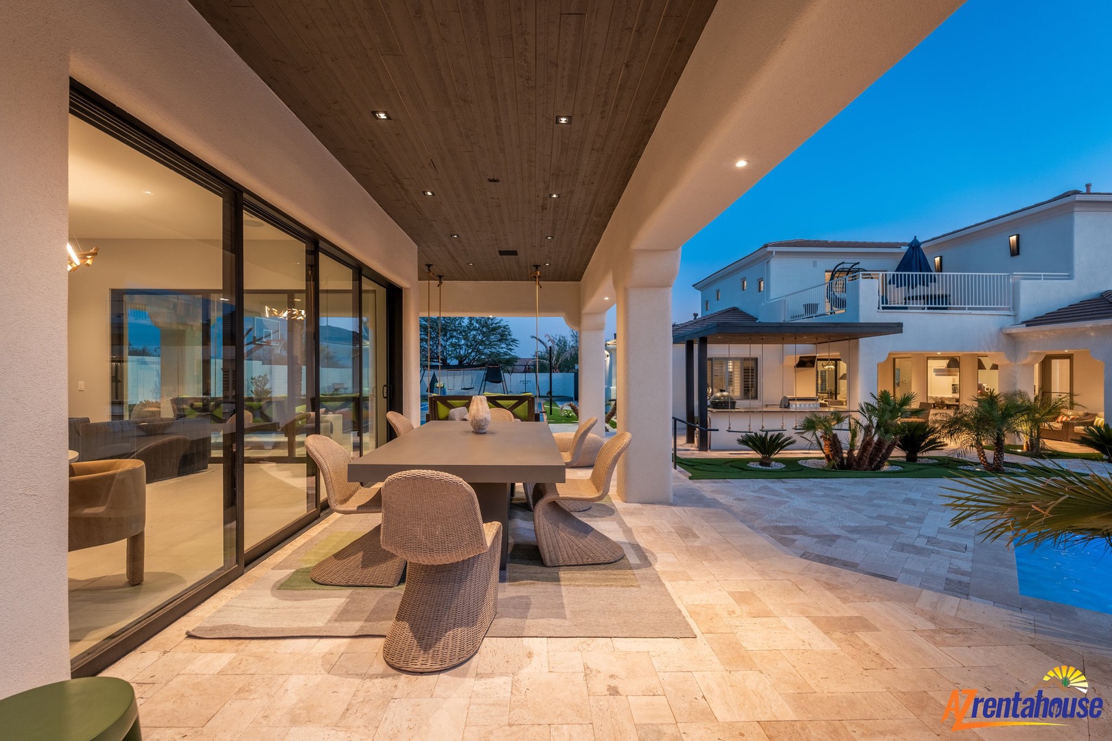 Dine under the stars on your private covered terrace, where elegant furnishings meet open-air luxury.