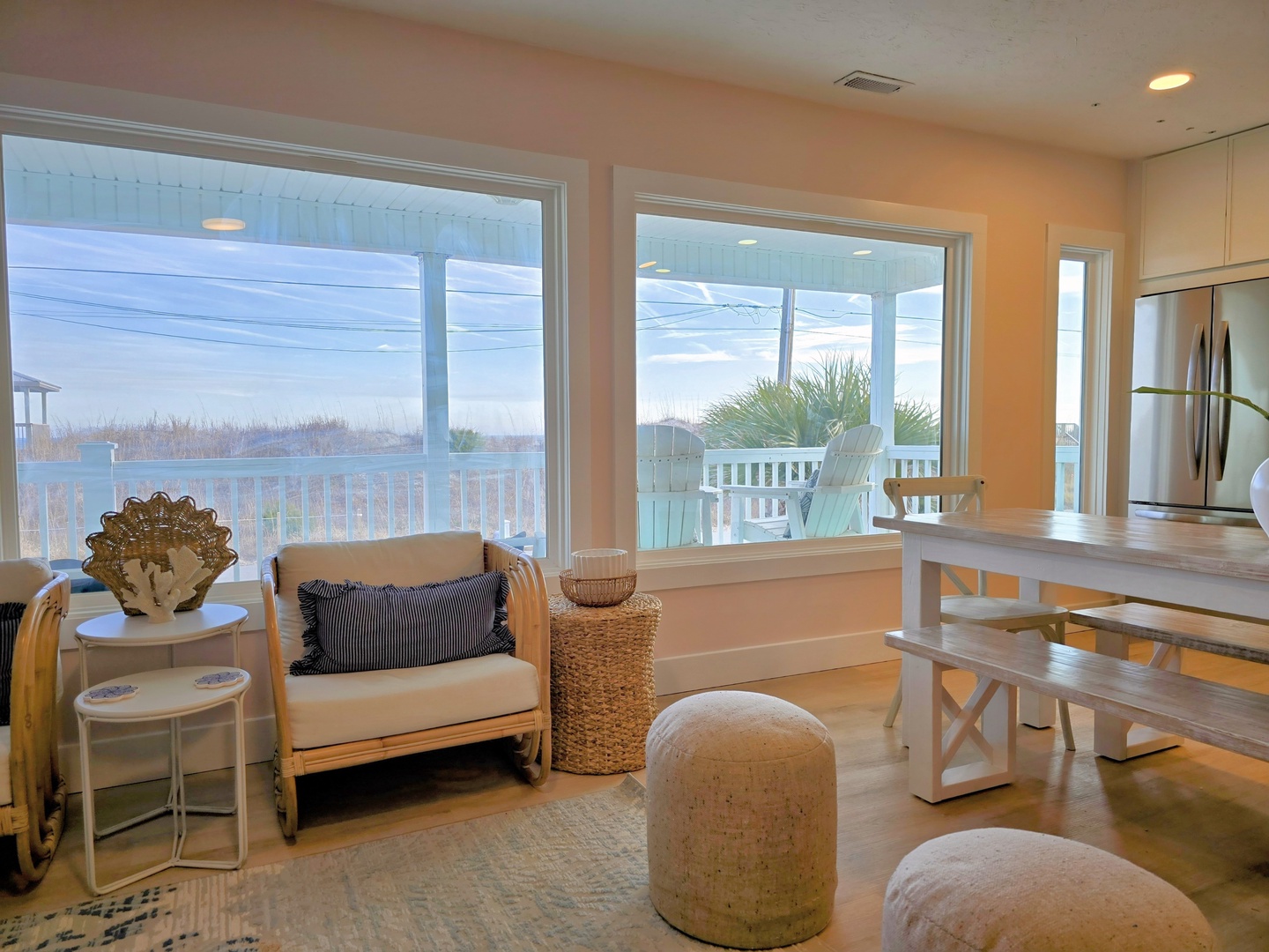 Relax in your bright coastal living space with stunning water views and comfortable seating perfect for morning coffee or evening conversations.