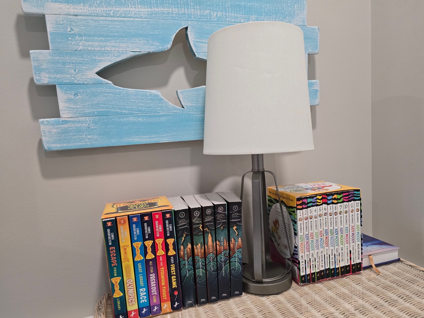Curl up with your favorite book in this cozy reading corner, where nautical charm meets comfort for perfect vacation reading moments.