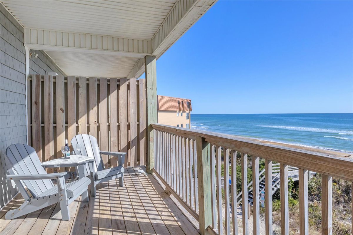 Step onto your private oceanfront balcony where Adirondack chairs await and endless blue horizon stretches before you.