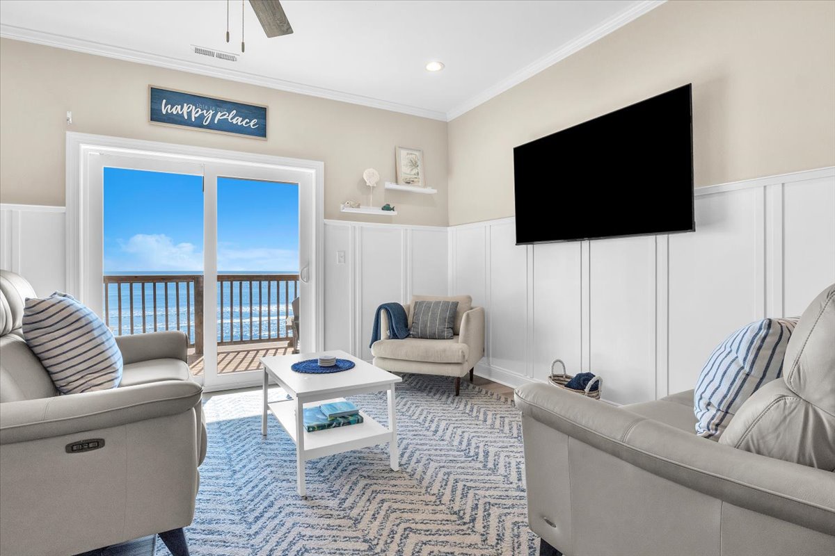 Unwind in your coastal living room where ocean views and comfy seating create your perfect retreat.