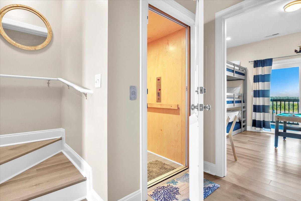 Step into your bright, welcoming space with soaring ceilings and warm wood floors that invite you to unwind in comfort.