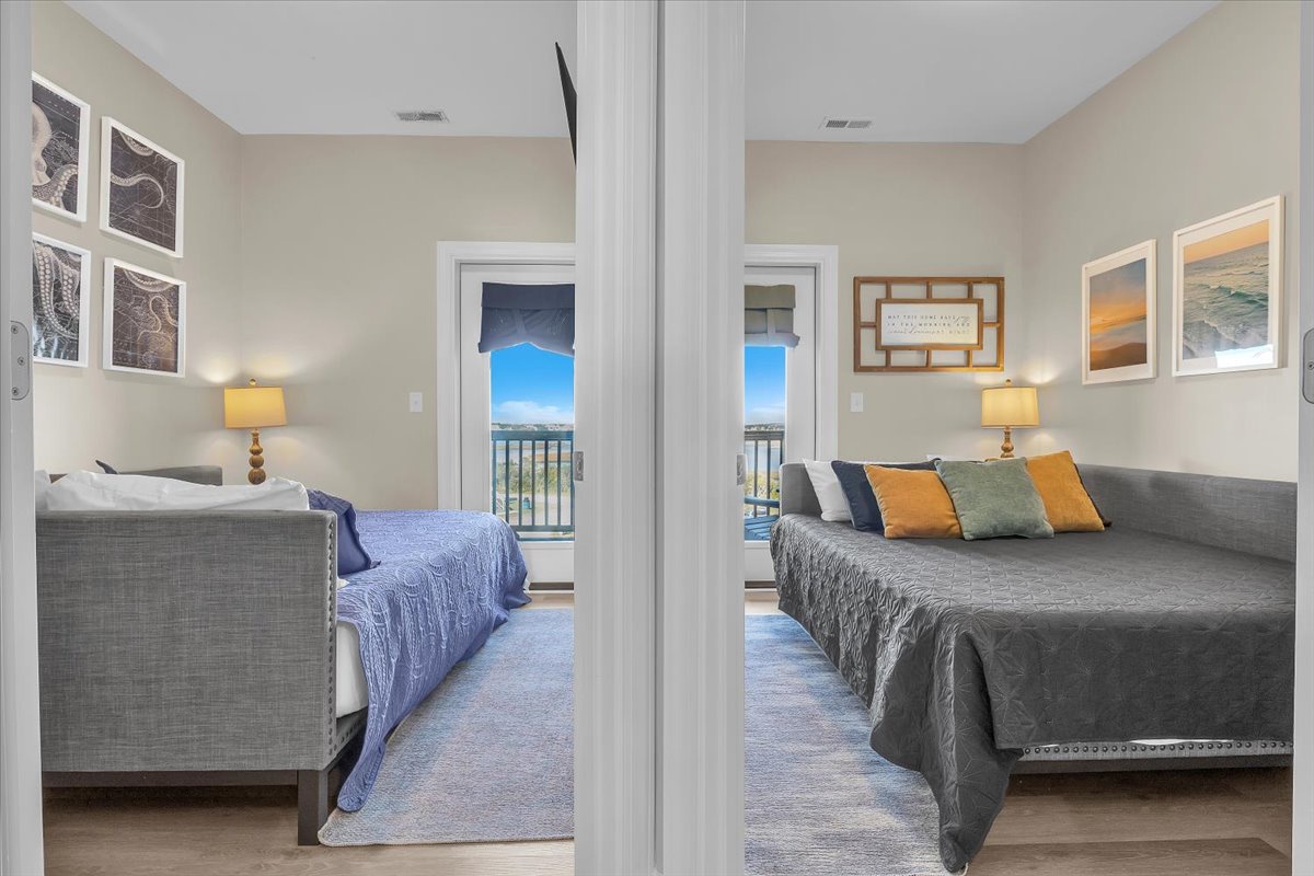 Wake up to lake views in your twin bedrooms, each thoughtfully decorated with soft linens and warm lighting for peaceful mornings.