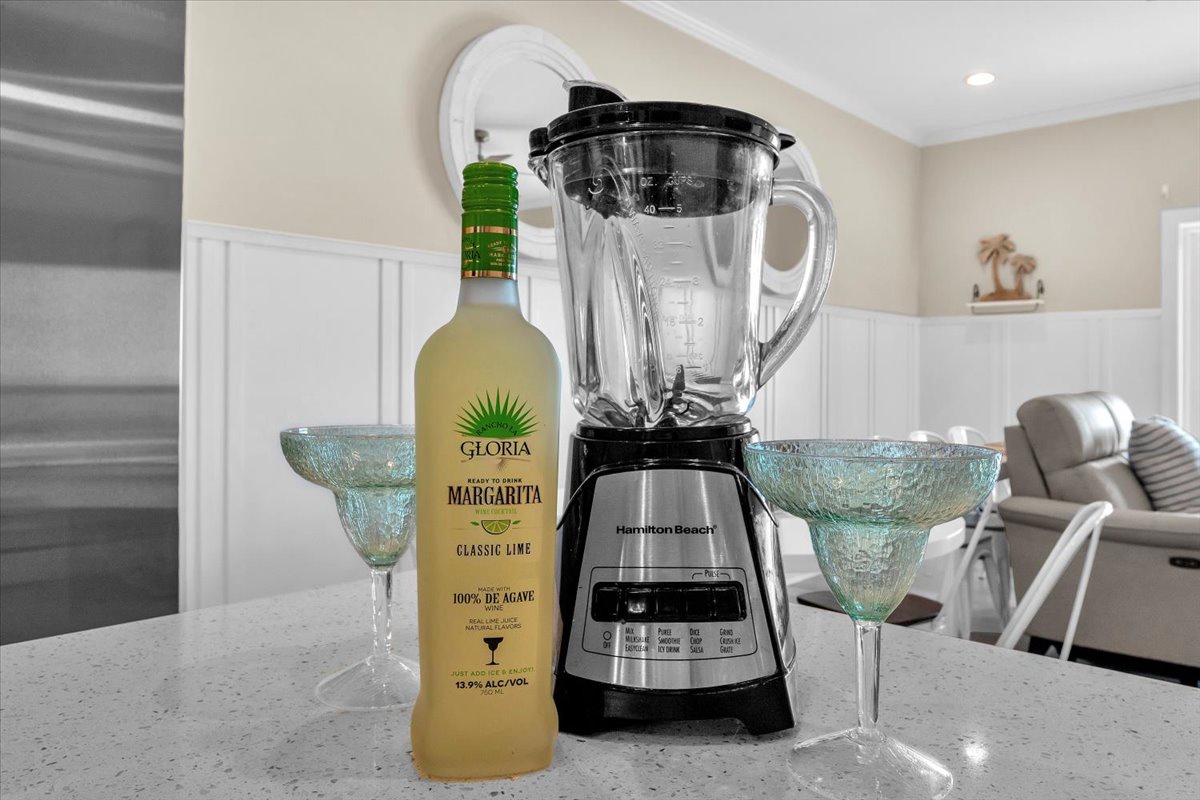 Blend perfect margaritas in your fully equipped kitchen with quality appliances and stylish glassware ready for your vacation celebrations.