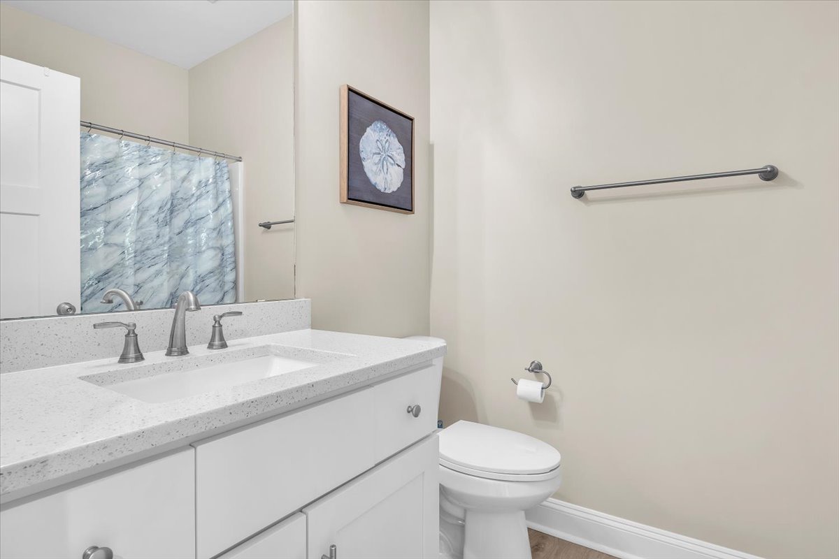 Your pristine private bathroom features granite countertops, a large mirror, and thoughtful touches that make freshening up feel luxurious.