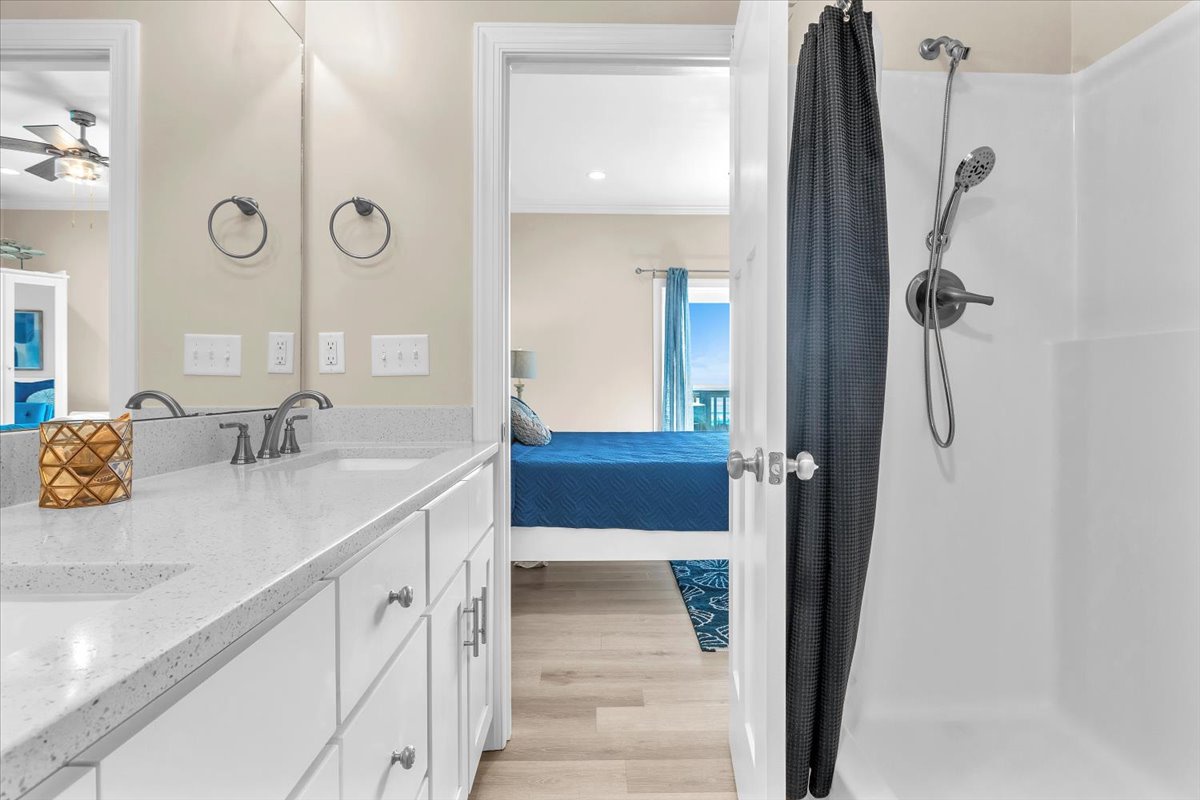 Freshen up in your spacious bathroom with dual vanities, walk-in shower, and thoughtful touches throughout.