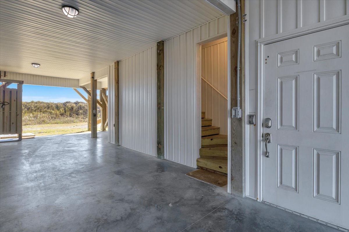 Step into your private entrance with convenient garage space and mountain views beyond the covered patio.