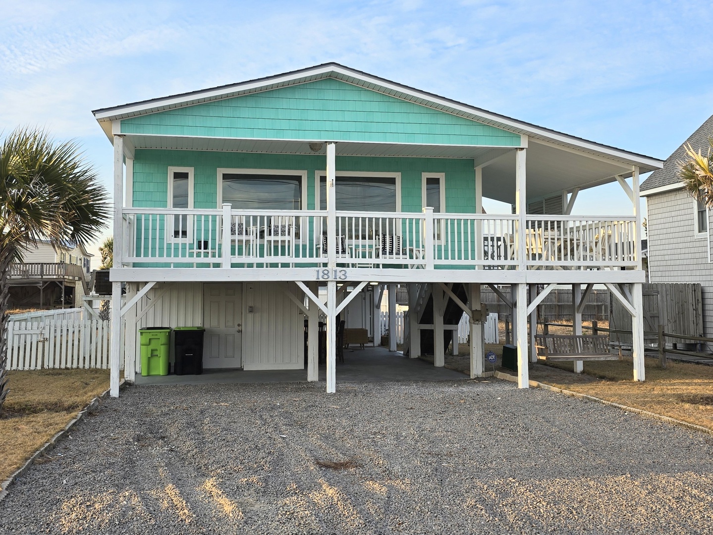 Charming coastal cottage elevated on stilts with covered parking and easy beach access in a peaceful residential neighborhood.