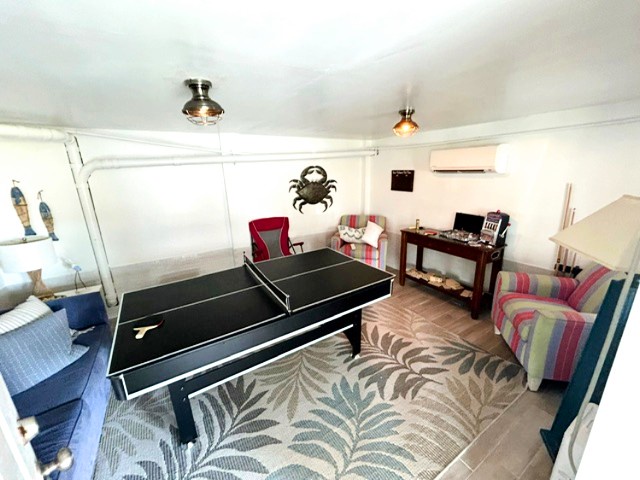 Challenge your friends to ping pong in this bright game room, complete with colorful seating and nautical charm for endless fun.