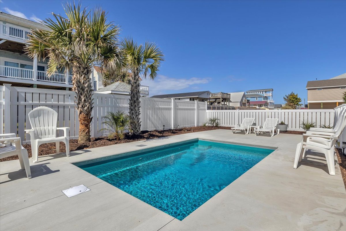 Dive into your private oasis! This sparkling pool awaits your morning laps and afternoon lounging sessions under swaying palms.