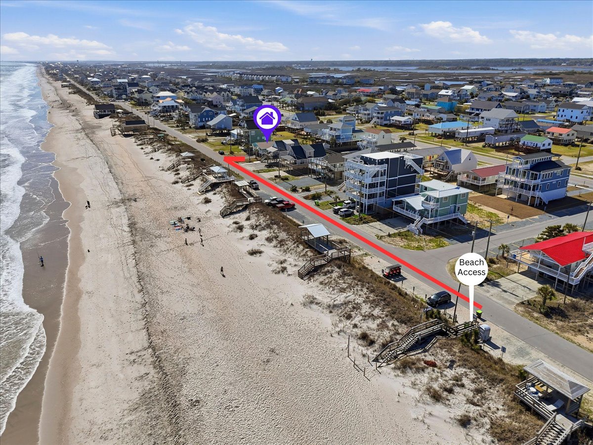 Aerial view shows the beachfront location with direct beach access and stunning coastal surroundings of this vacation rental community.
