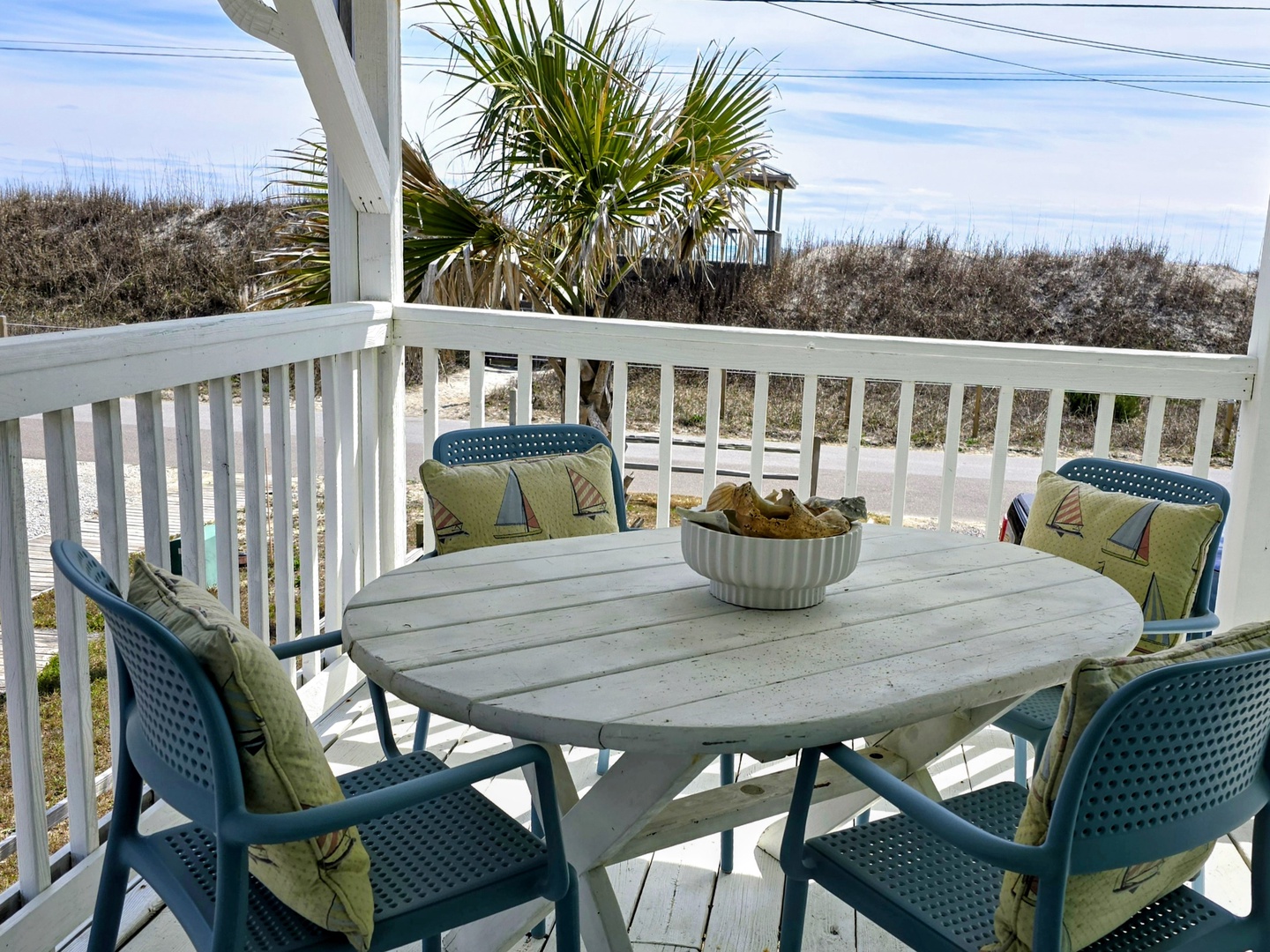 Savor morning coffee at your private dining spot with coastal breezes and natural dunes as your backdrop.