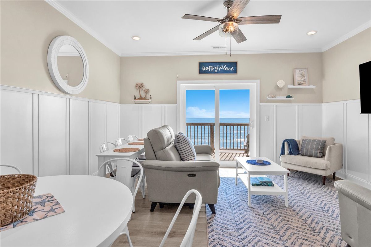 Sink into coastal comfort in your bright living space with stunning ocean views from your private balcony.