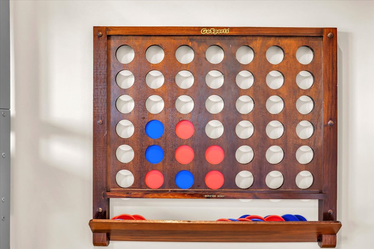 Challenge friends to classic Connect Four in your cozy game corner, where strategic fun awaits between relaxing moments.