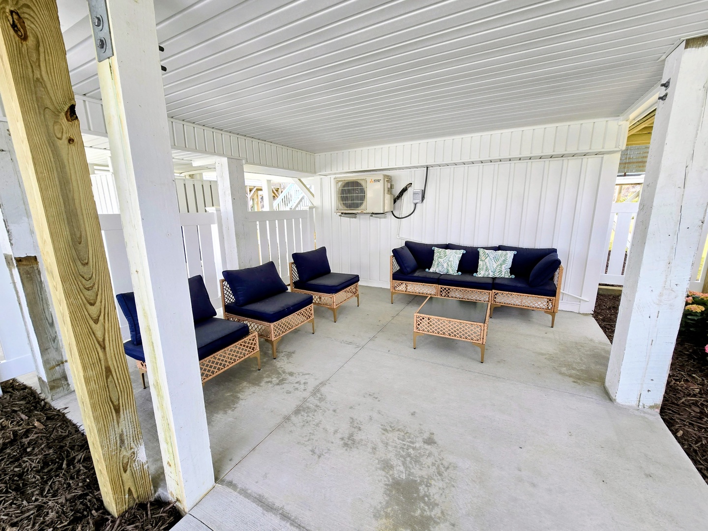 Your private covered patio offers comfortable seating and cool shade, perfect for morning coffee or evening relaxation.