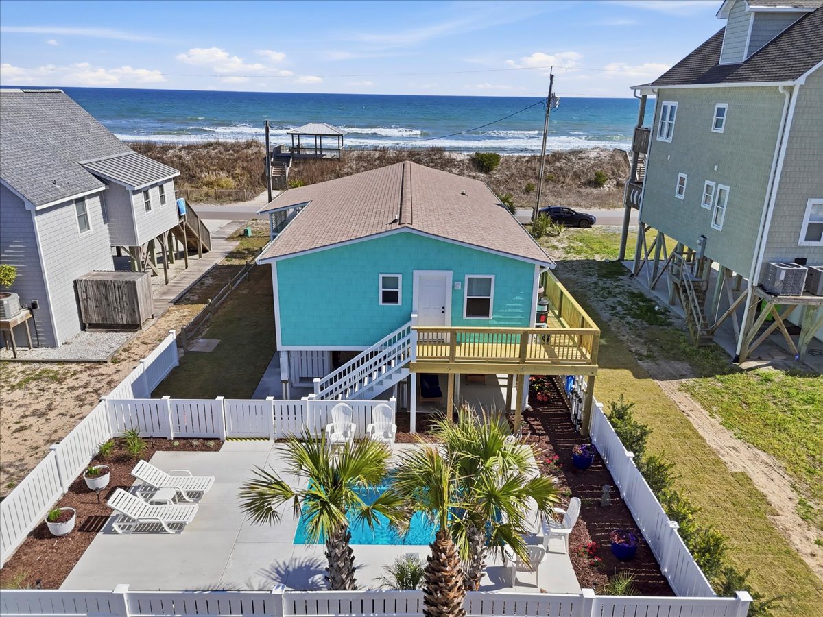 Charming beachfront cottage with private pool and ocean access in a peaceful coastal neighborhood.
