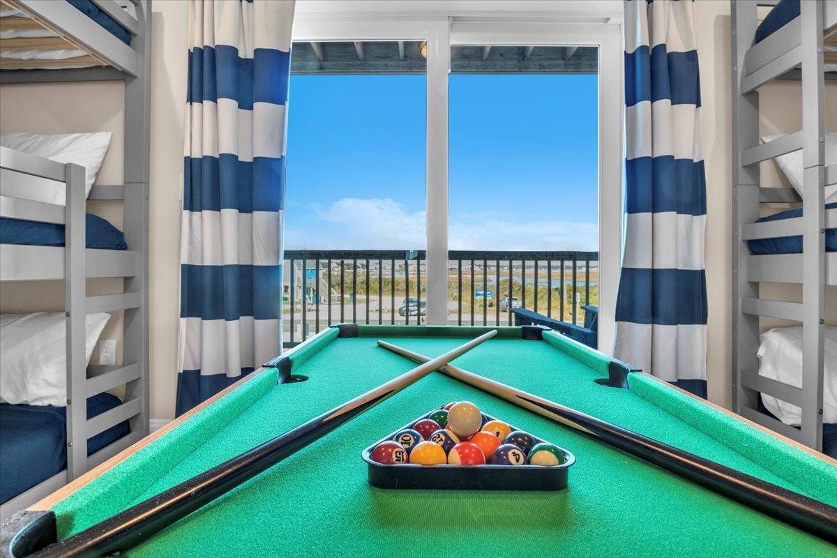 Challenge your family to a game while soaking up stunning views through the bright coastal windows.