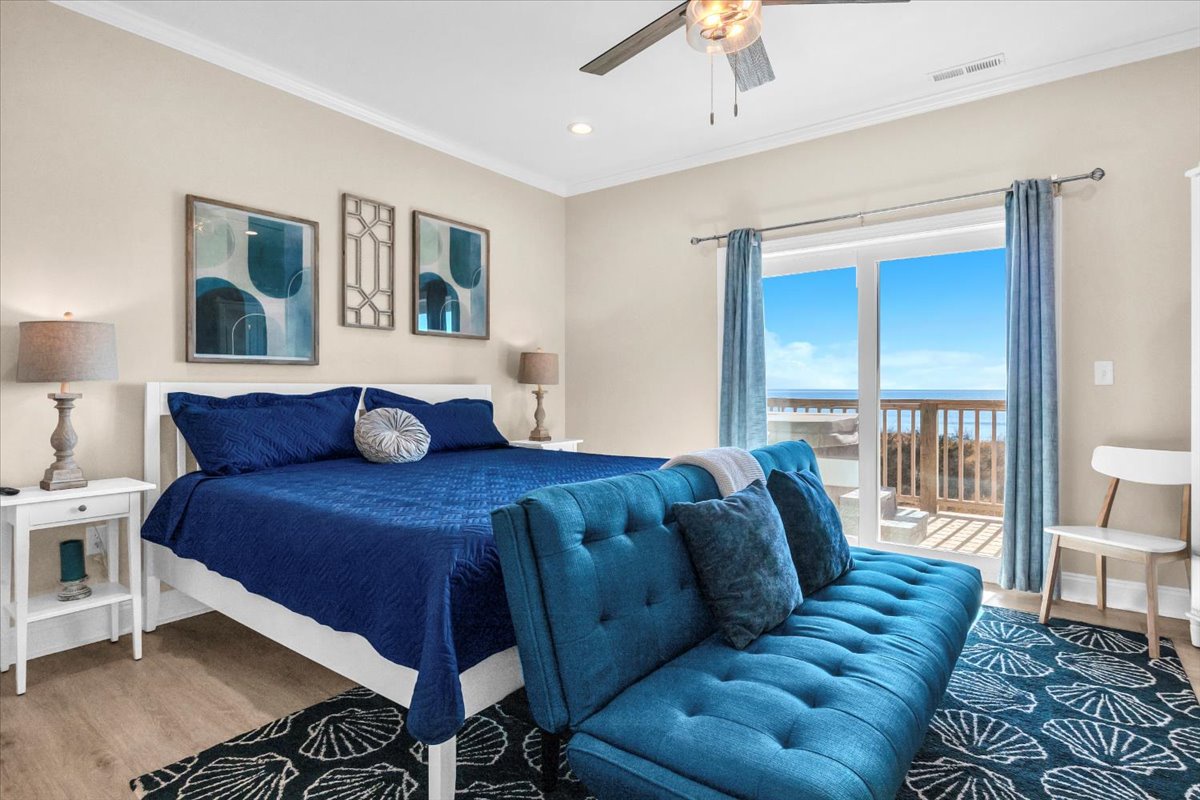 Wake up to ocean views from your elegant bedroom, where coastal blues and luxurious comfort create the perfect seaside sanctuary.