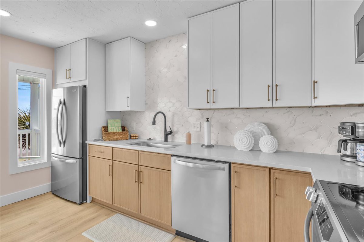 Your modern galley kitchen features sleek marble countertops, stainless steel appliances, and ample storage for all your culinary adventures.