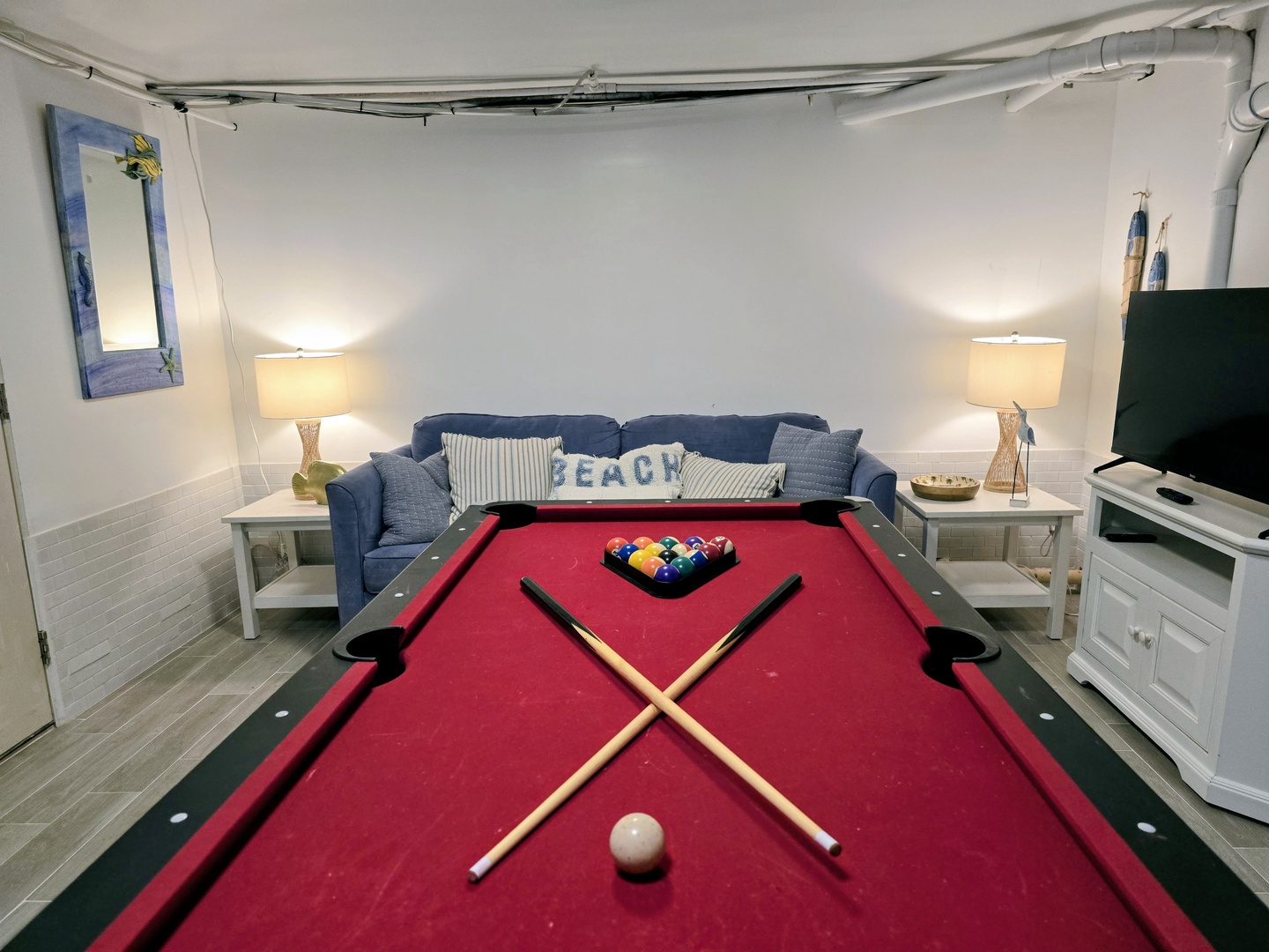 Challenge friends to pool games in your cozy basement retreat, complete with comfy seating and TV for the perfect game night.