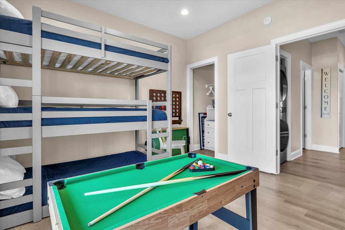 Your game room combines fun and rest with bunk beds and a pool table for endless entertainment.