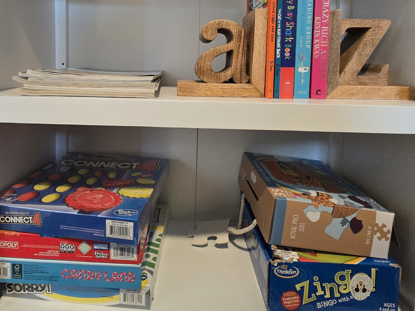 Unwind with your group over classic board games and good reads from this thoughtfully stocked entertainment shelf.