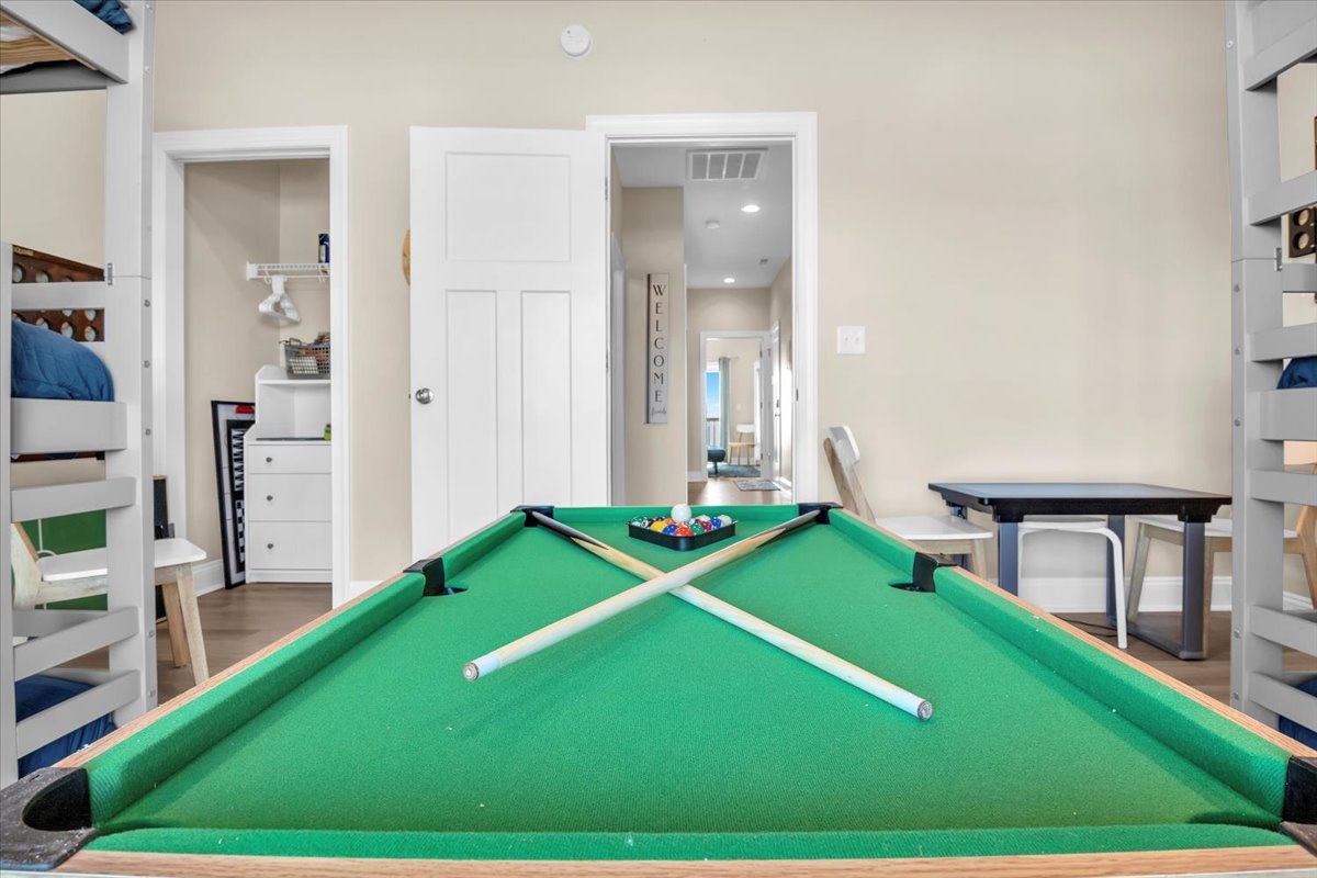 Challenge friends to a game of pool in your private entertainment space, complete with bunk beds for the kids.