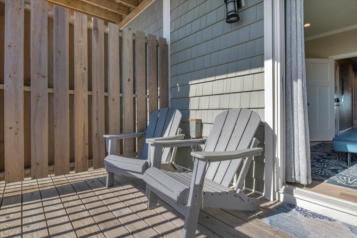 Sink into these Adirondack chairs on your private deck, where morning coffee tastes better with the gentle rhythm of ocean breezes.