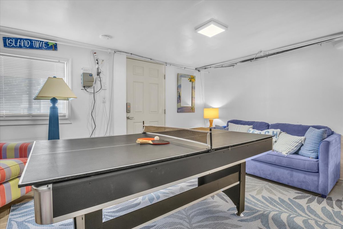 Your own game room awaits with ping pong fun and cozy seating for post-match relaxation.