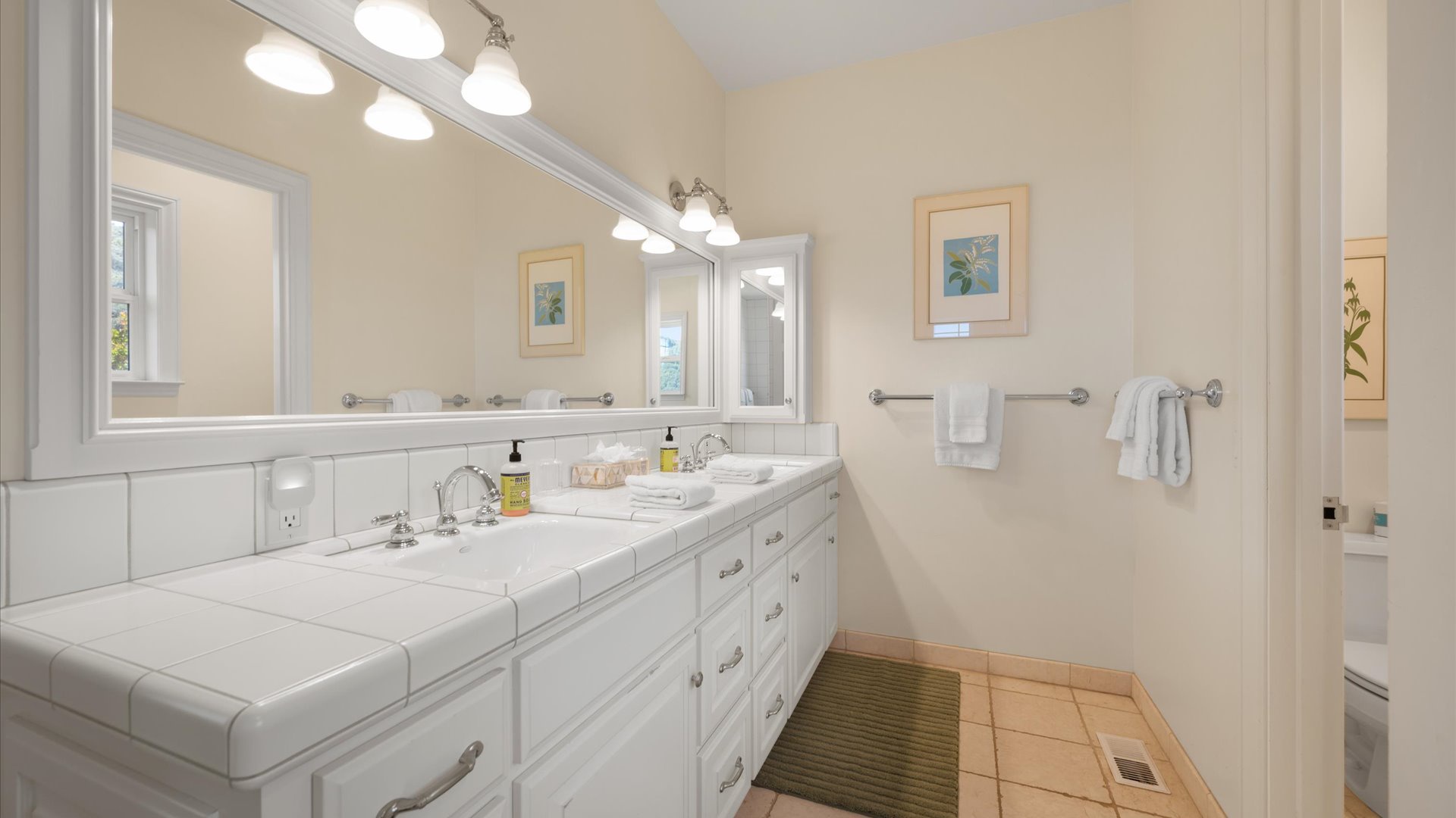 Ensuite bath features dual vanities, a spacious walk-in shower and seperate soaking tub