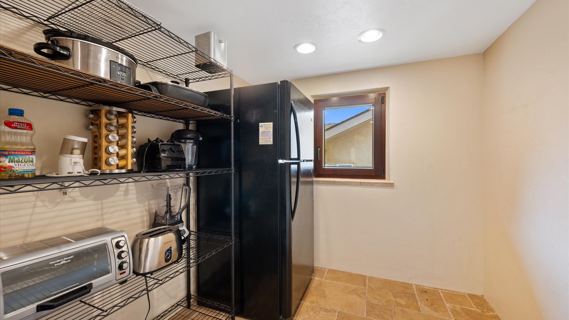 Pantry upstairs offers additional fridge and freezer for guest use