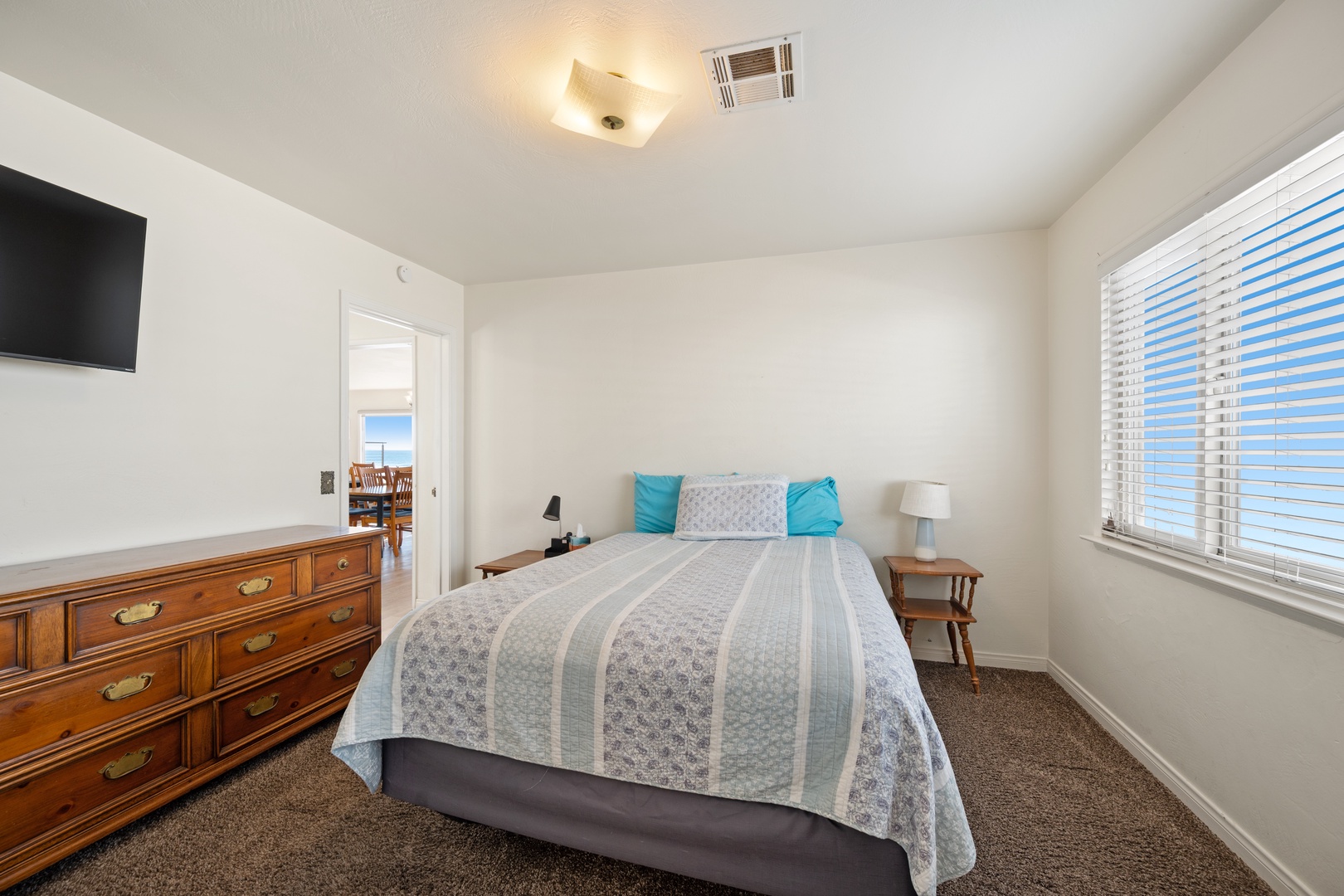Upstairs first bedroom located off the main entry near the dining and living area