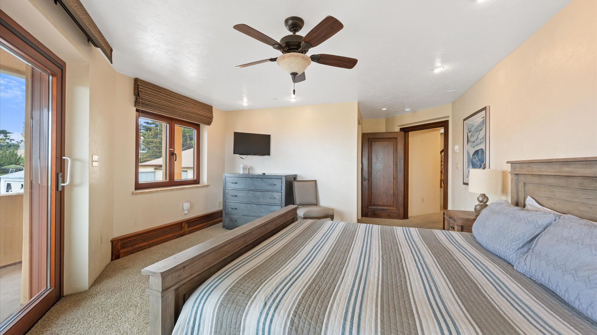 Unwind in your peaceful bedroom, the Carmel Suite, located downstairs