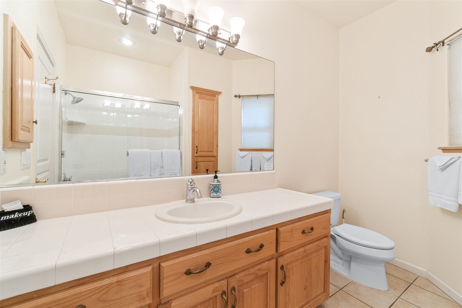 The third bathroom is located downstairs with a tub/shower combo.